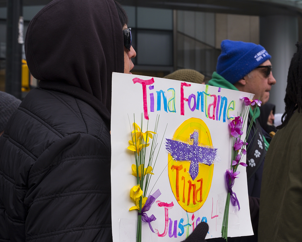 Demonstrators showing a justice for Tina Fontaine sign