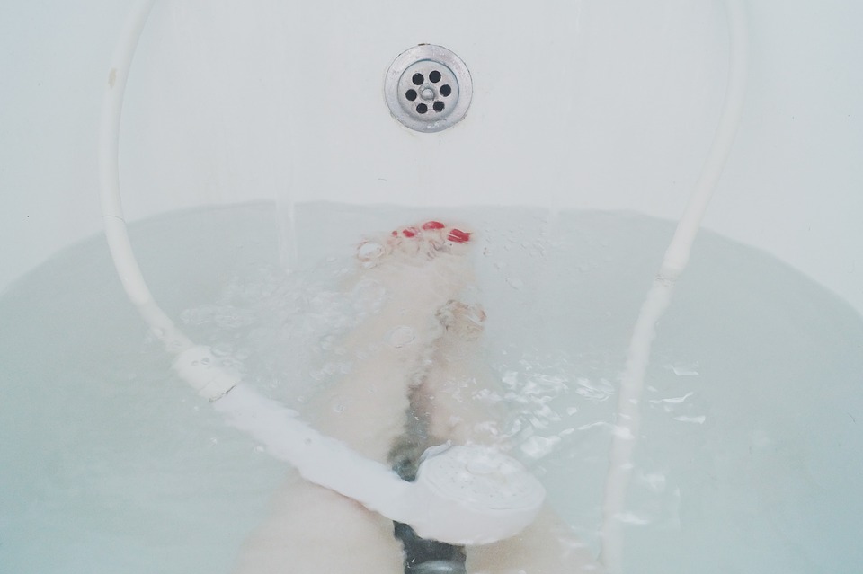 woman's feet in a bathtub