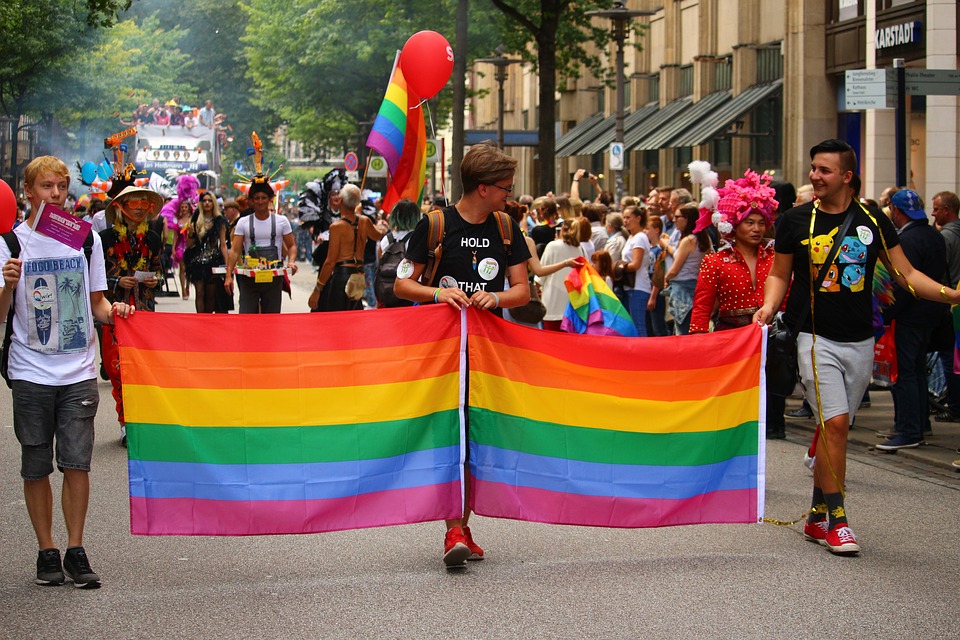 Pride Day marchers with rainbow flag