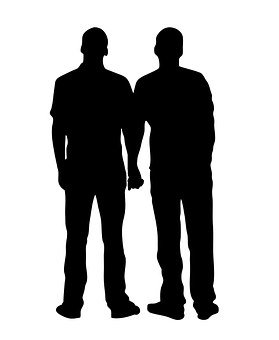 silhouette of two men holding hands