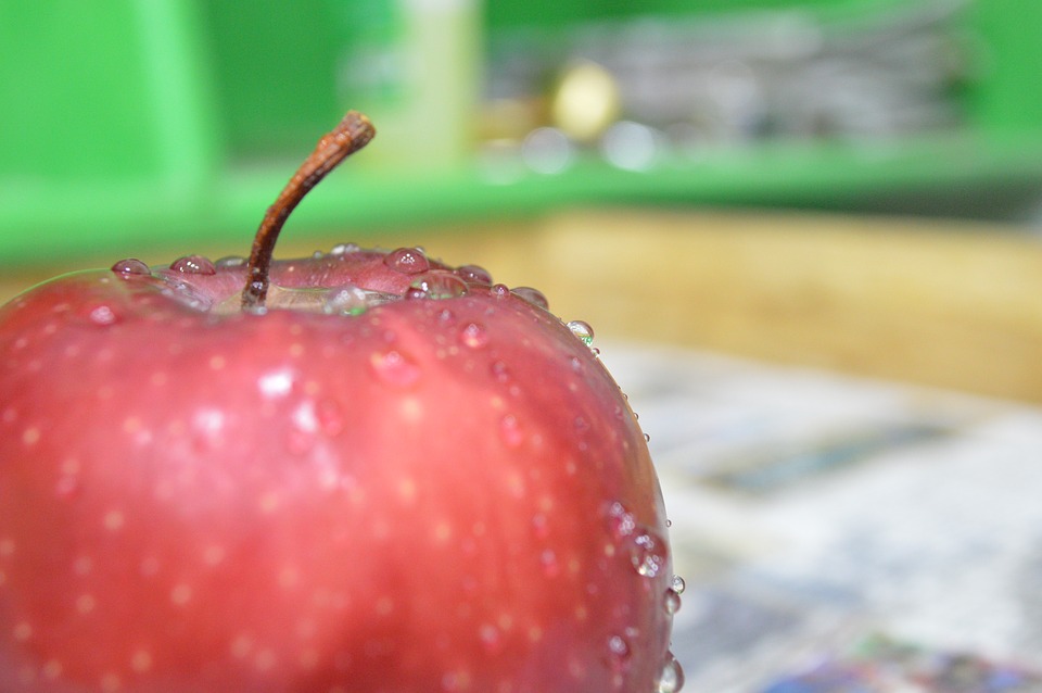 dewy apple sitting on a desk
