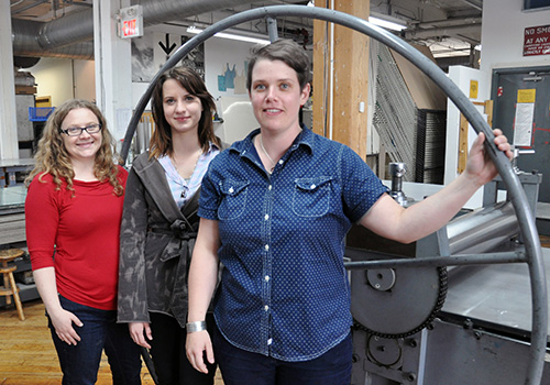 Guelph fine arts graduates Sara Kelly, Laura Bydlowska and Anna Gaby-Trotz work at Open Studio and keeping the printmaking tradition alive.