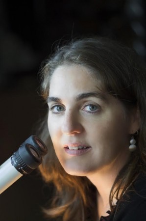 a photo of Prof. Nina Jones at a microscope