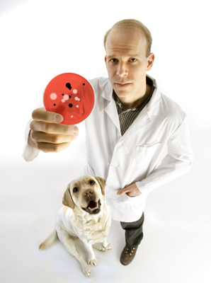 a photo of Scott Weese holding a petri dish