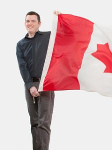 Professor waving a Canadian flag