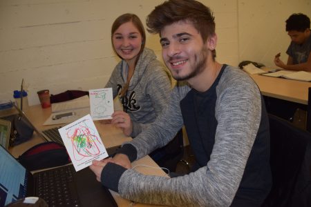 Students holding Card of Caring from Child Care and Learning Centre