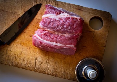 slab of steak on a wood cutting board