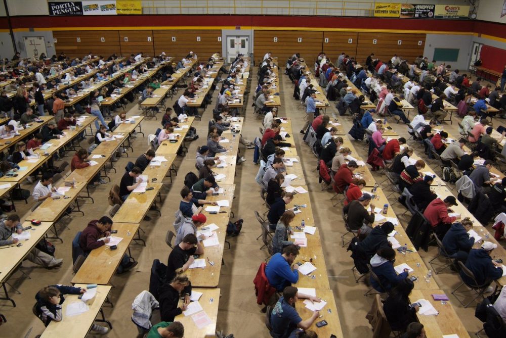 Rows of students writing exams in the W.F. Mitchell gym