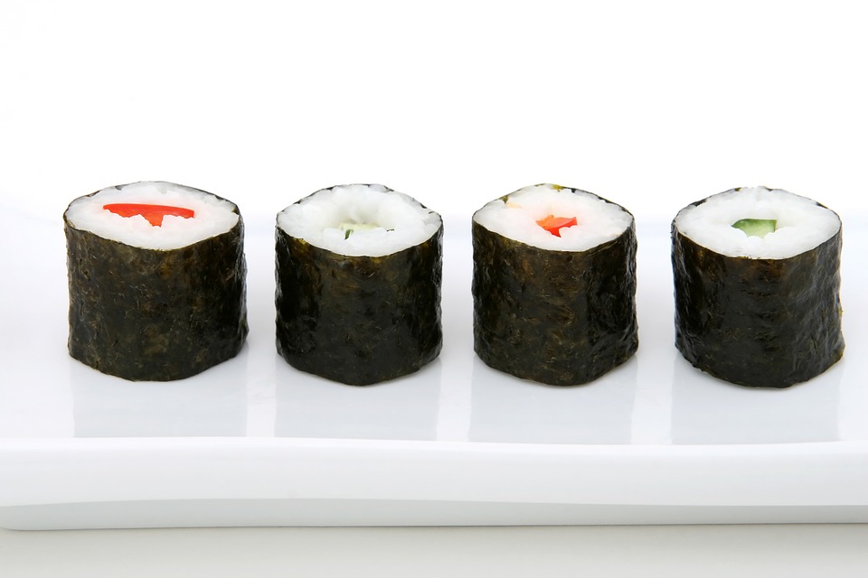 sushi maki with salmon on a plate