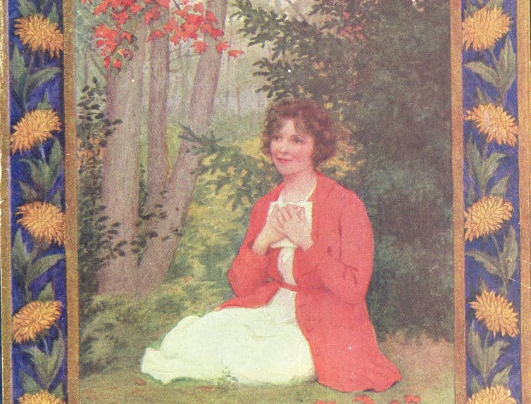 The 1921 book cover of ‘Rilla of Ingleside.’ A woman kneeling by the woods pressing a letter to her chest
