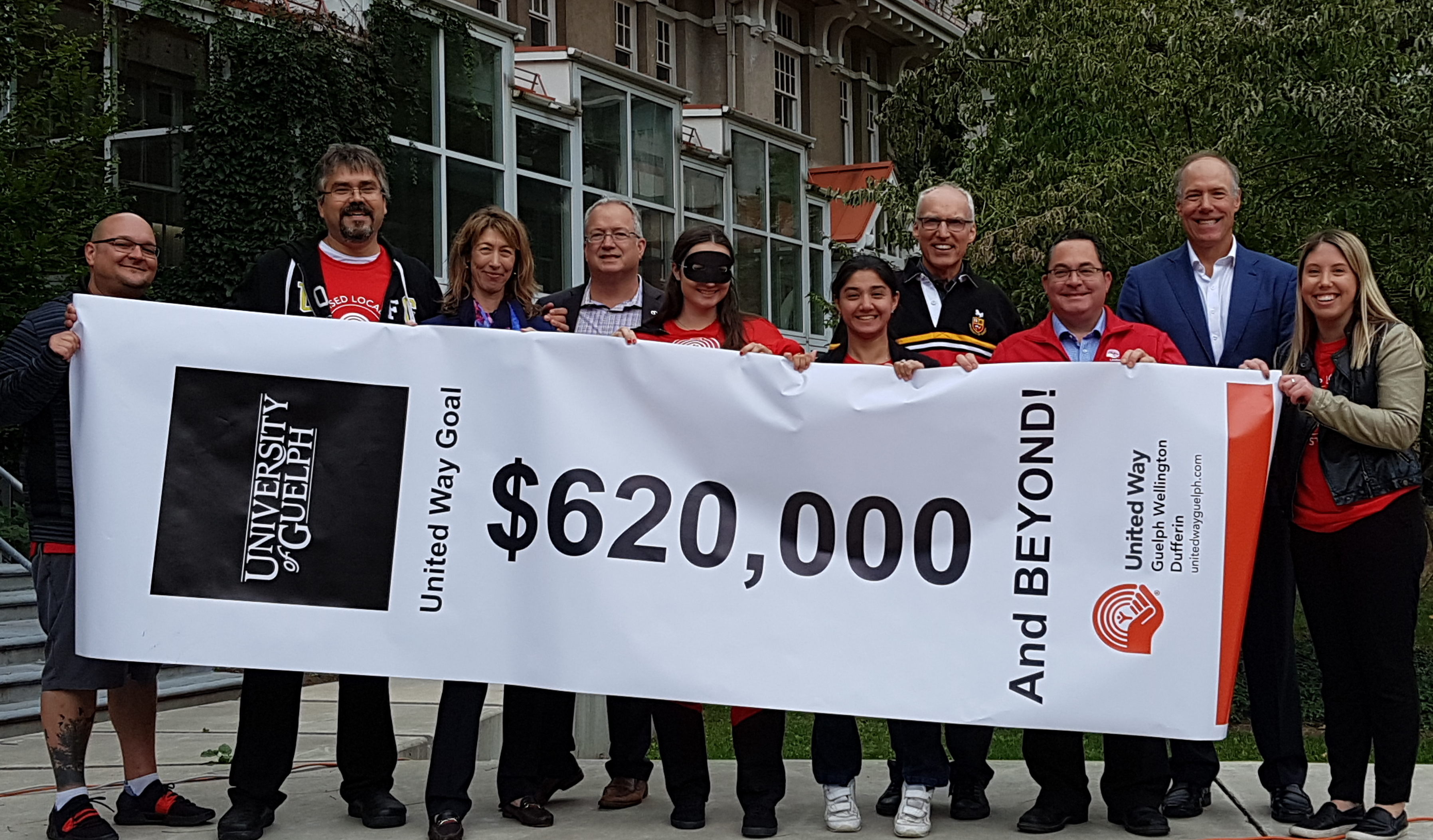 Members of the steering committee and senior leaders hold the 2018 United Way goal: $620,000 and beyond