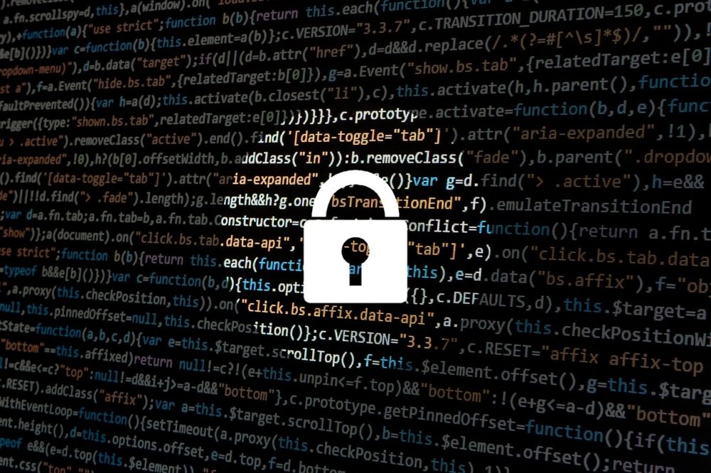 image of a lock with computer coding in the background