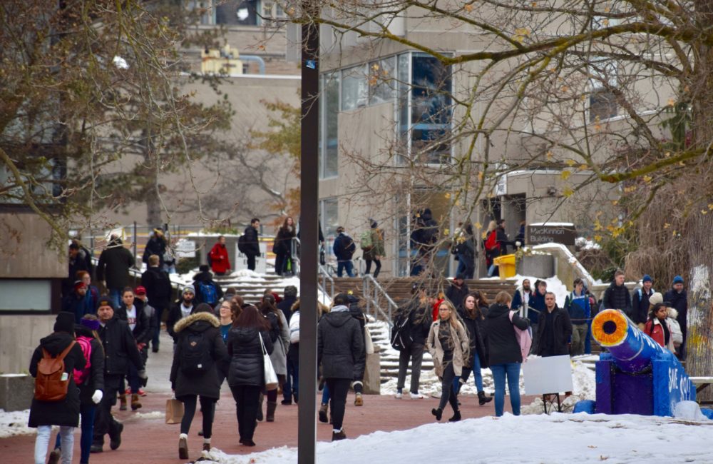 Late afternoon crowd scene on campus