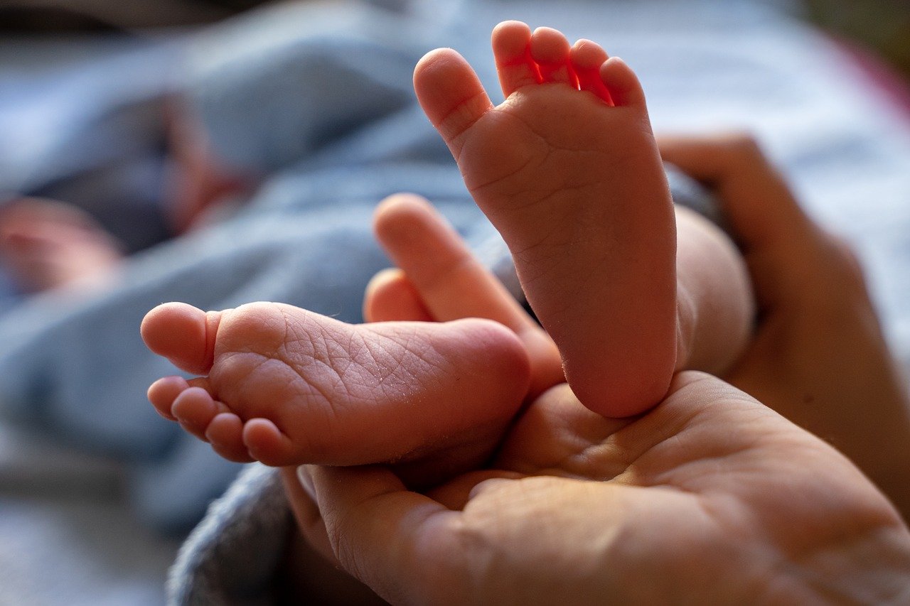 A newborn baby's feet are shown