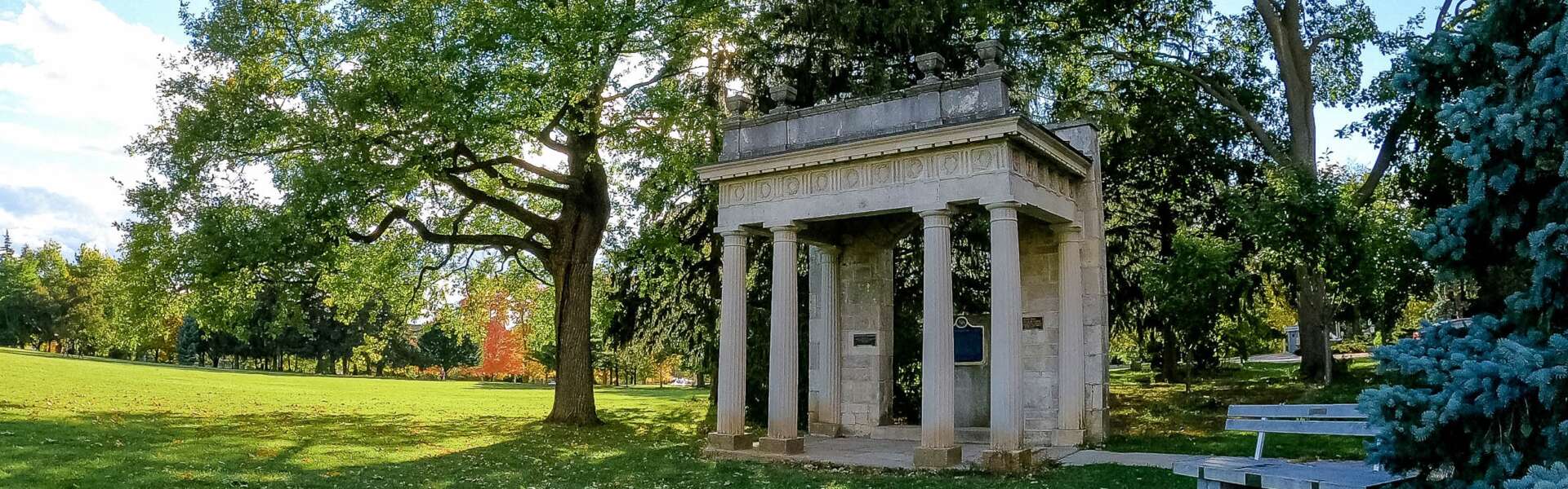 The portico surrounded by trees in the summer