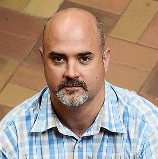 A headshot photo of Dr. Pat Barclay