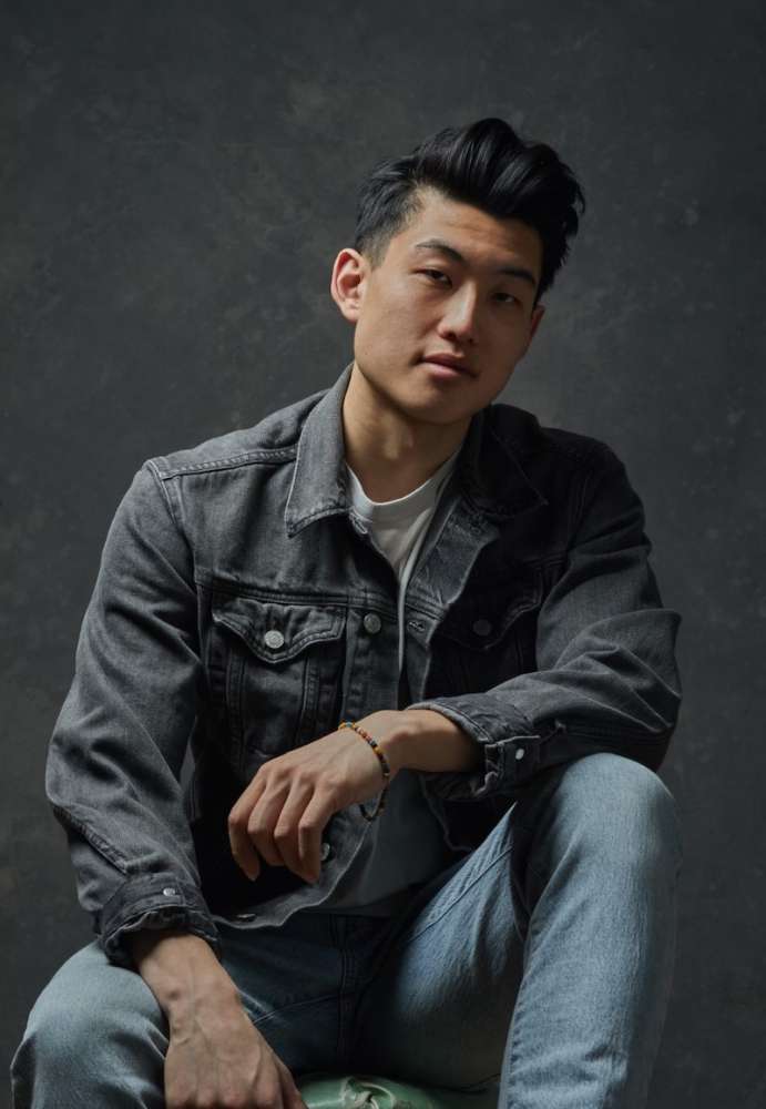 Young Asian man in denim shirt