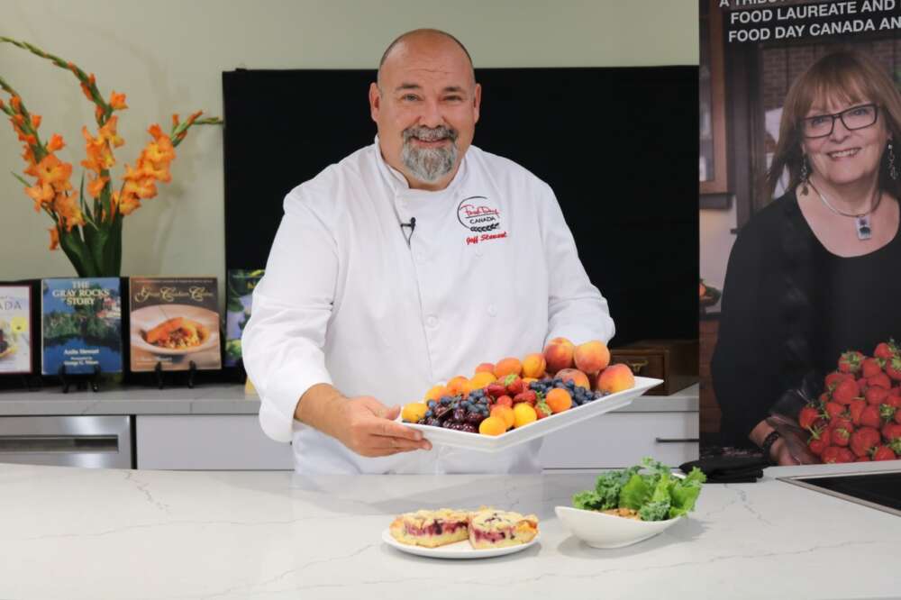 Chef displays tray of fruit