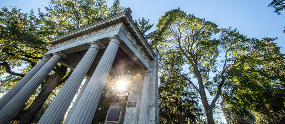 Portico on U of G Campus with sunbeams peeking through the columns