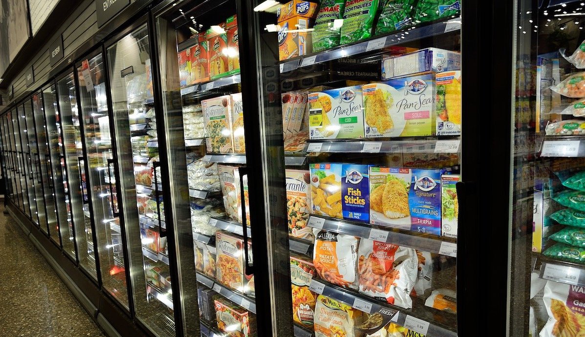 The frozen-food section of a grocery store is shown