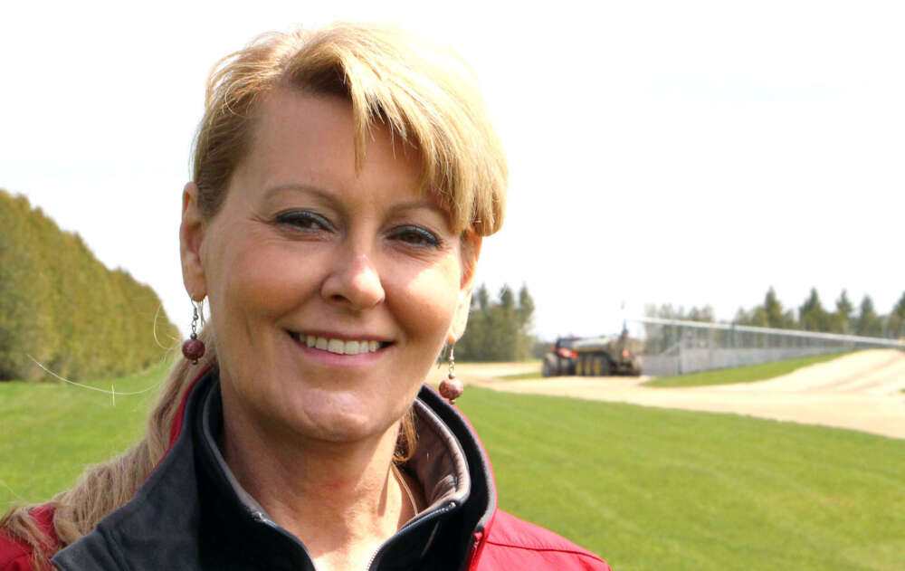 Woman professor headshot in outdoor setting