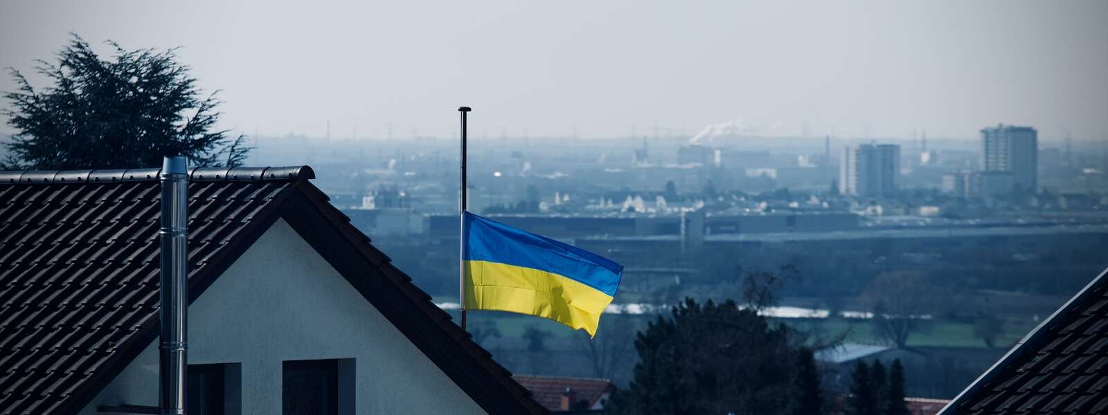 The Ukrainian flag (top half blue, bottom half yellow) flies at half mast in Germany.