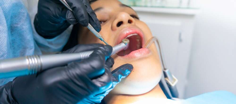A patient gets dental treatment.