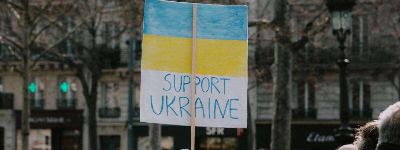 Large Group of People Holding Banner on Supporting Ukraine