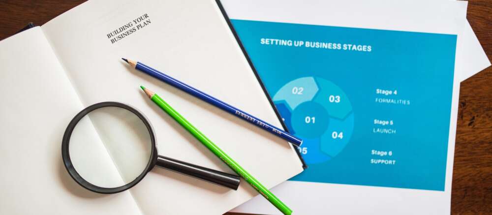 Black Magnifying Glass on White Paper