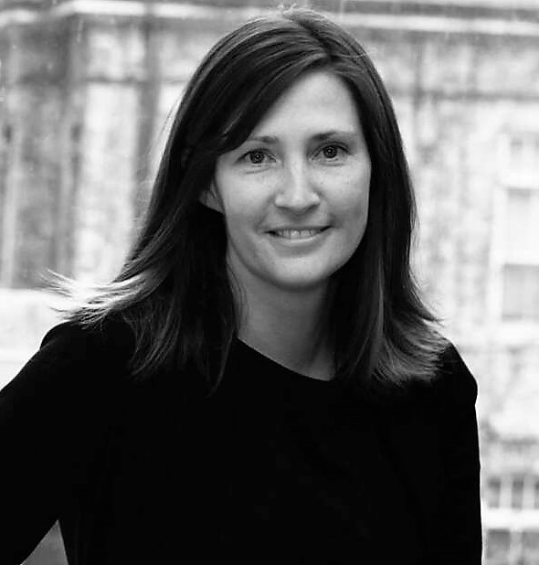 A black and white photo of Dr. Kim Martin smiling