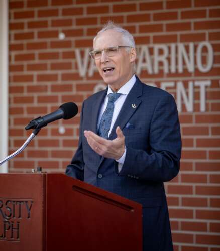 Former U of G president Franco Vaccarino speaks at a podium