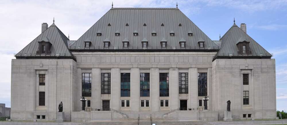 The exterior of the large stone Supreme Court building in Ottawa