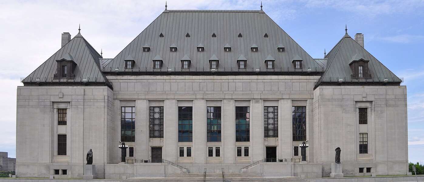 The exterior of the large stone Supreme Court building in Ottawa