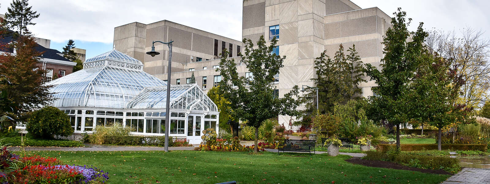 The conservatory gardens in front of the concrete university centre on the U of G campus