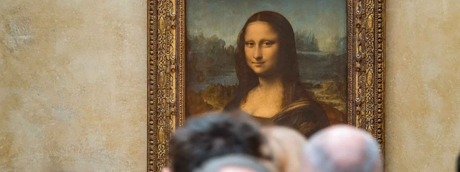 The backs of heads in front of Da Vinci's "Mona Lisa"