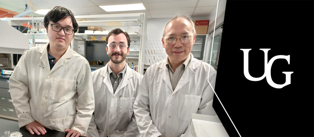 three men in chemistry lab wearing lab coats alongside the U of G cornerstone logo