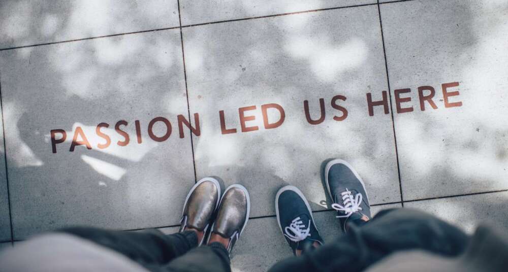 two person standing on gray tile paving
