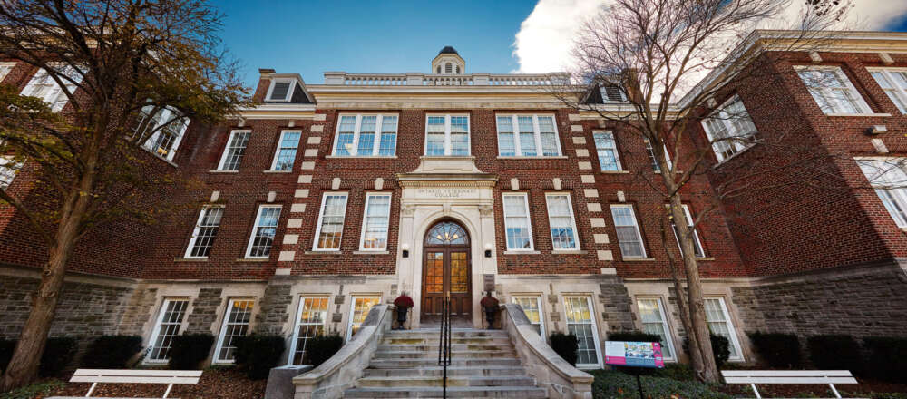 A wide-angle view of the frong entrance of the Ontario Veterinary College main building