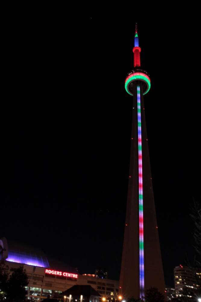 The CN Tower lit up as a DNA barcode