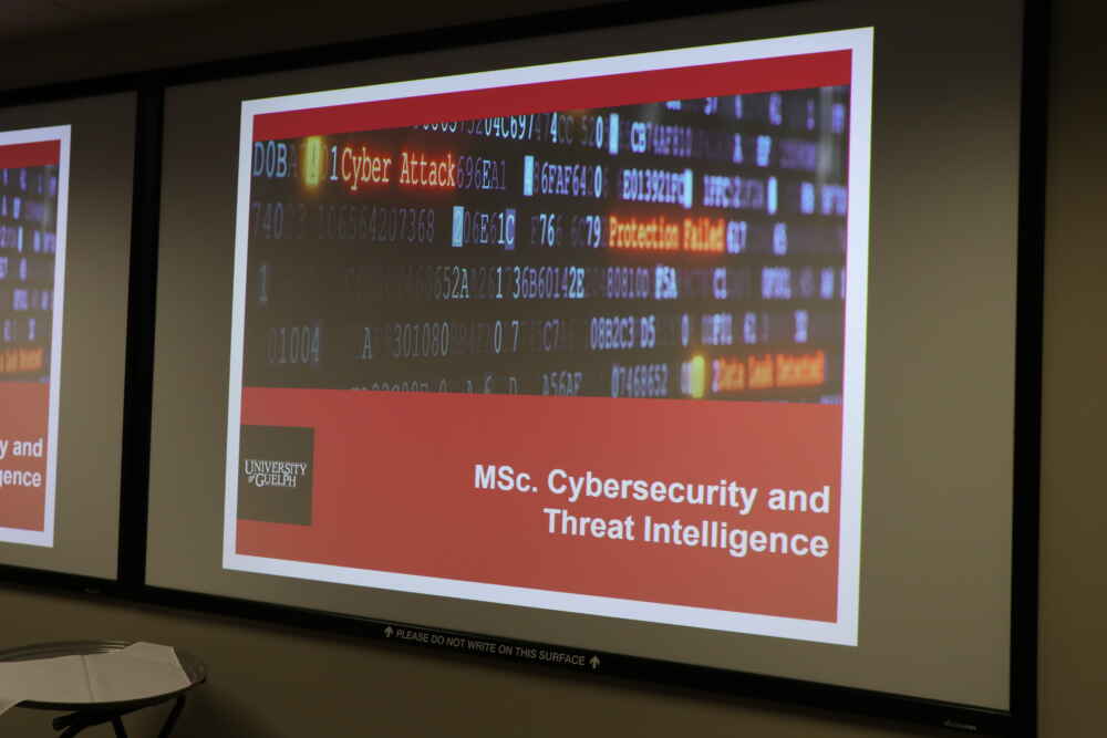 A digital sign in the MCTI Cyber Space displaying the words "MSc. Cybersecurity and Threat Intelligence"