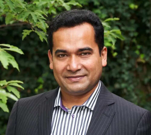 Dr. Ataharul Chowdhury poses for a photo outside