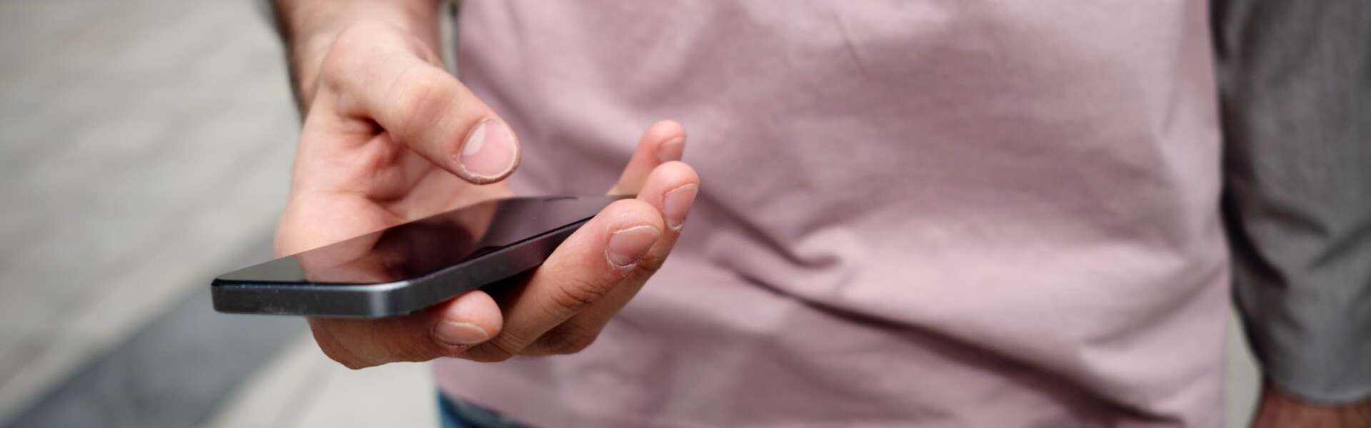 A closeup of a hand holding a cellphone