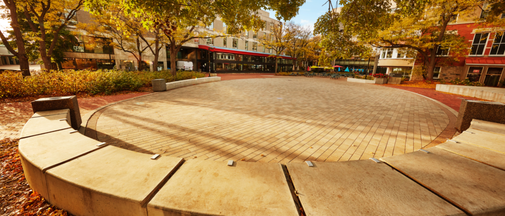 The semi-circle of cement benches in Branion Plaza.
