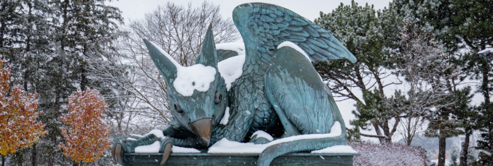 The U of G Gryphon statue covered in a dusting of snow.