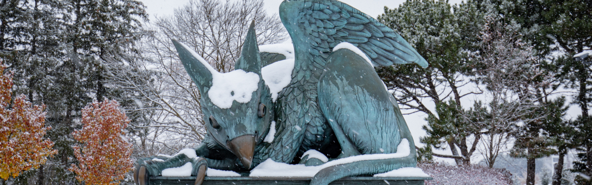 The U of G Gryphon statue covered in a dusting of snow.