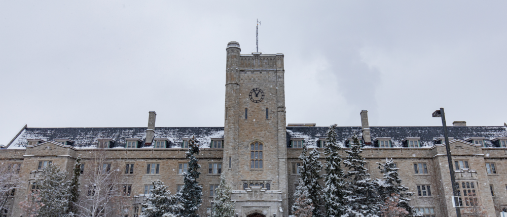 Johnston Hall against a cloudy sky on a snowy day.