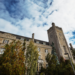 Johnston Hall against a partly-cloudy sky.