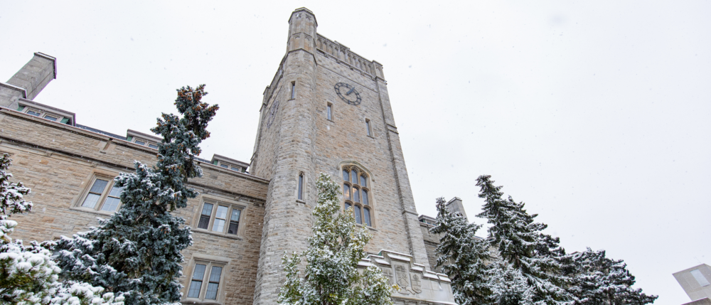 Looking up at Johnston Hall on a snowy day.