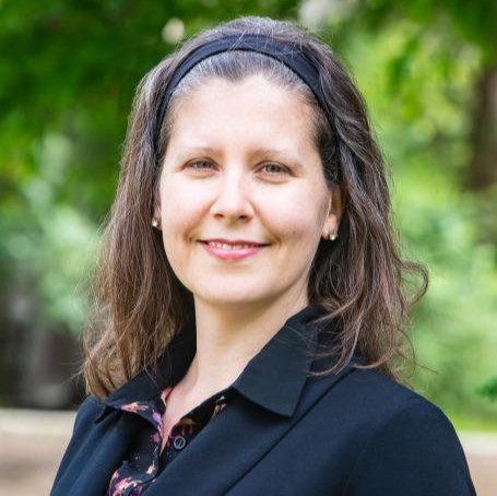 Dr. Kate Parizeau poses for a portrait while standing outside