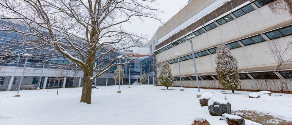 The summerlee science complex on a snowy day.